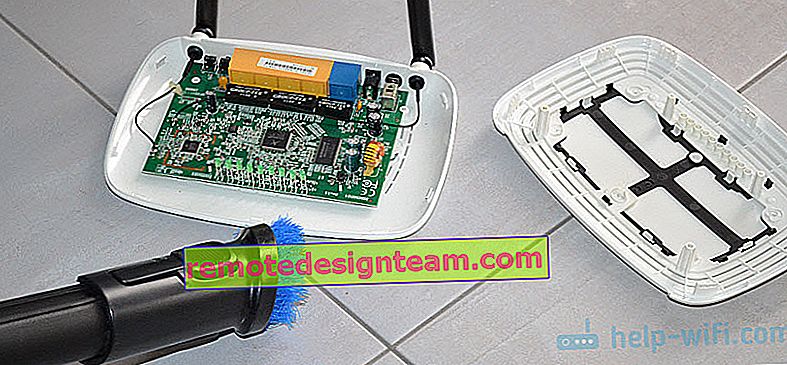 Membersihkan router dari debu dengan penyedot debu